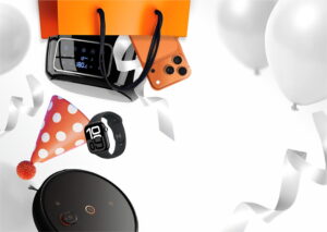 Orange gift bag with a smartwatch, orange phone case and other gadget accessories on a festive backdrop with ribbons and party decor.