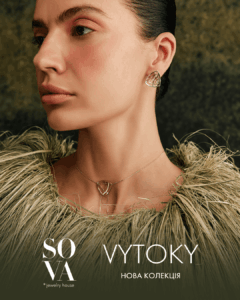 Close-up of a woman wearing a geometric gold earring and a delicate pendant necklace; fashion jewelry ad for SOVA Jewelry House's new collection, VYTOKY.
